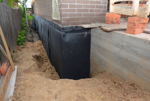 Happy homeowners after waterproofing job in Pierson